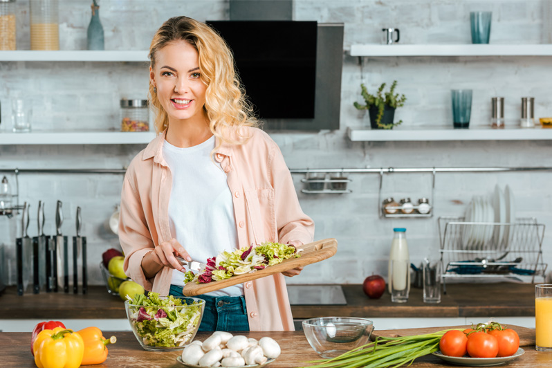 Happy smiling woman with nutritional food